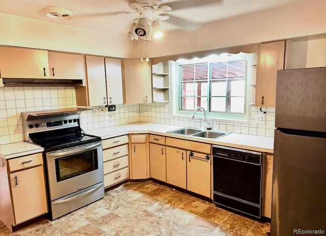 kitchen with light countertops, appliances with stainless steel finishes, a sink, and decorative backsplash