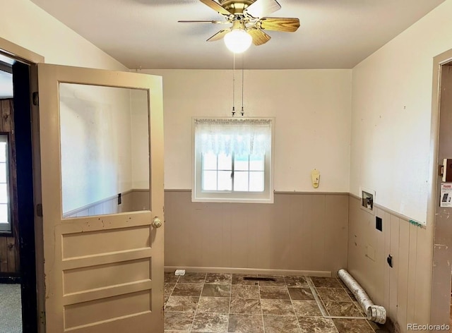 laundry area featuring a ceiling fan, washer hookup, laundry area, and wainscoting