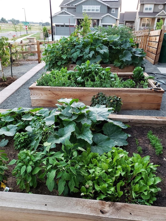 view of yard with a vegetable garden and fence