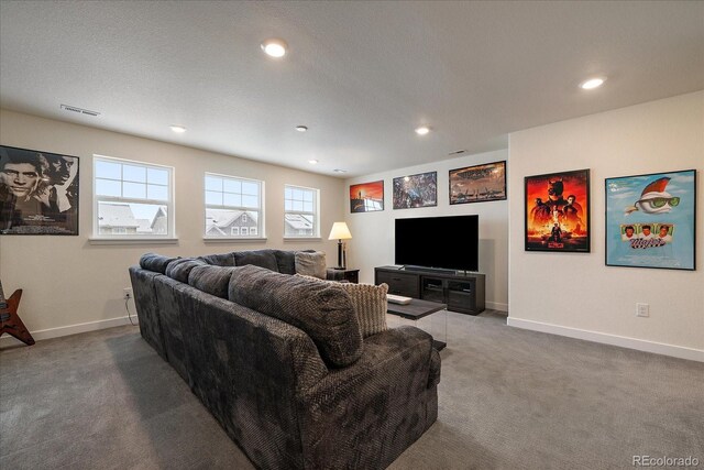 carpeted living room featuring recessed lighting, visible vents, and baseboards