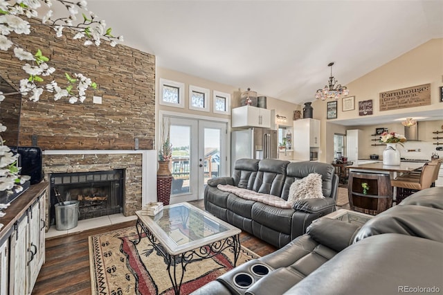 42313 Vista Rdg, Parker, CO 80138 - living room featuring dark wood-type flooring, french doors, high vaulted ceiling, a chandelier, and a fireplace
