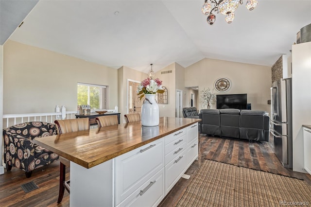 42313 Vista Rdg, Parker, CO 80138 - kitchen featuring wooden counters, freestanding refrigerator, white cabinetry, dark wood finished floors, and a chandelier