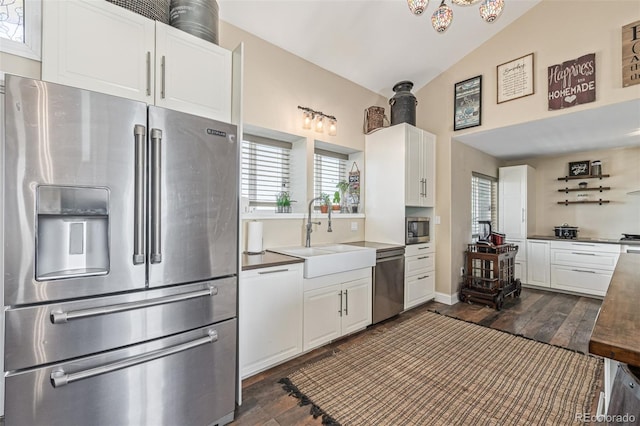 42313 Vista Rdg, Parker, CO 80138 - kitchen featuring stainless steel appliances, dark wood-style floors, white cabinets, and lofted ceiling