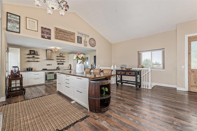 42313 Vista Rdg, Parker, CO 80138 - kitchen featuring stainless steel oven, white cabinets, wall chimney exhaust hood, dark wood-type flooring, and dark countertops