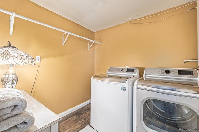 42313 Vista Rdg, Parker, CO 80138 - laundry area with washing machine and clothes dryer and wood finished floors