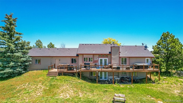 42313 Vista Rdg, Parker, CO 80138 - back of house with french doors, a wooden deck, a lawn, and roof with shingles