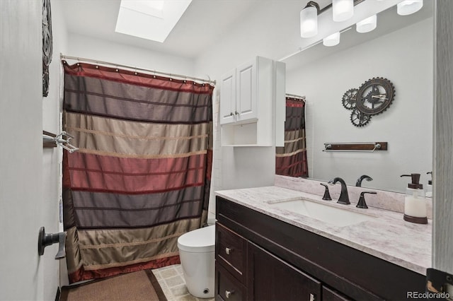 11337 E 1st Ave, Aurora, CO 80010 - bathroom with a skylight, vanity, and toilet