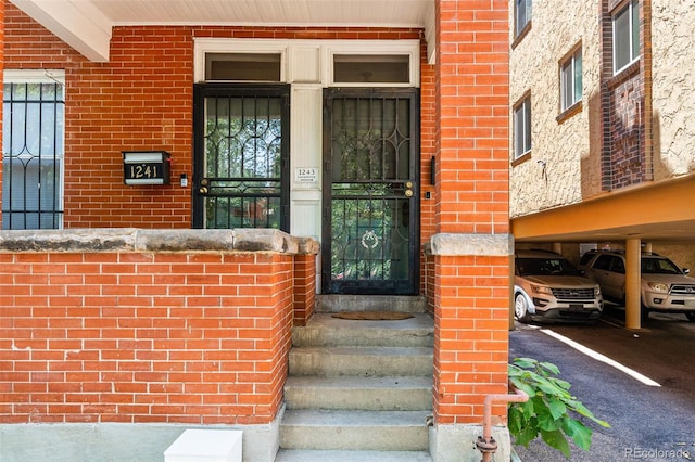 property entrance with brick siding