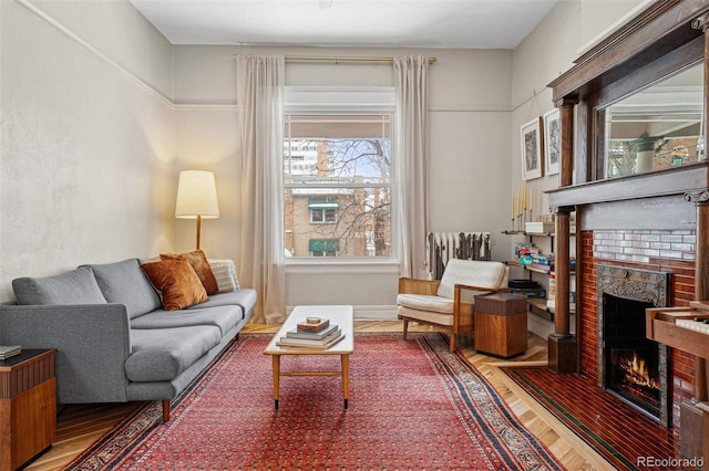 living area featuring a fireplace, radiator heating unit, and wood finished floors