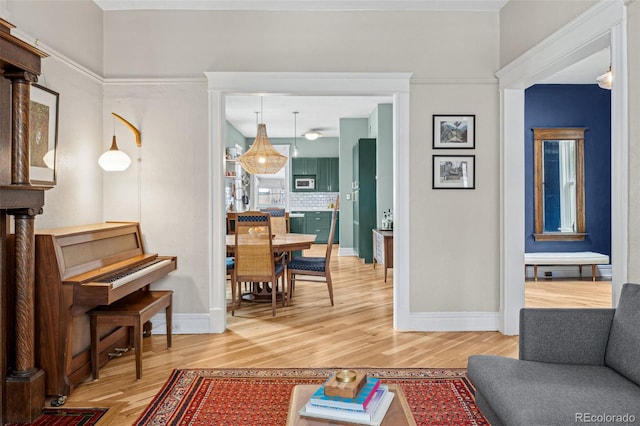 living room featuring light wood-style floors and baseboards