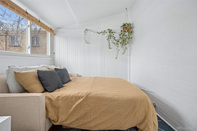 bedroom featuring vaulted ceiling