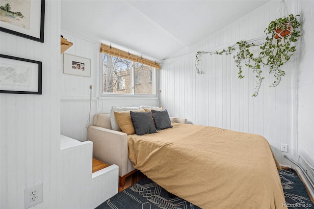 bedroom featuring vaulted ceiling