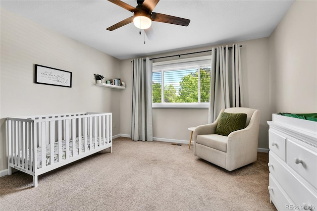 11209 Quivas Loop, Westminster, CO 80234 - bedroom featuring carpet flooring, a nursery area, baseboards, and ceiling fan