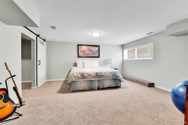 11209 Quivas Loop, Westminster, CO 80234 - carpeted bedroom with a barn door and baseboards