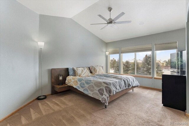 carpeted bedroom with ceiling fan and lofted ceiling