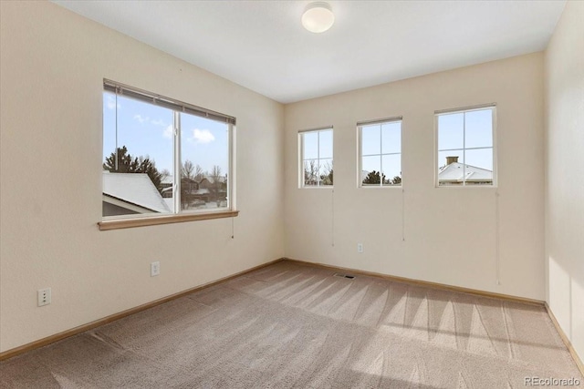 view of carpeted spare room