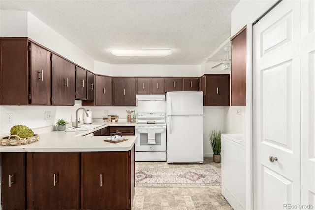 kitchen featuring sink, dark brown cabinets, a textured ceiling, kitchen peninsula, and white appliances