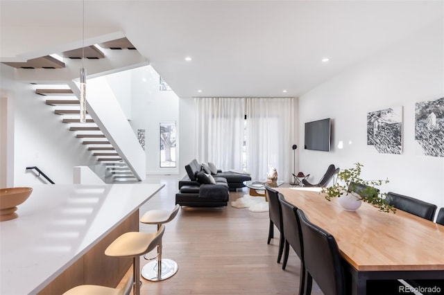 dining space with light hardwood / wood-style flooring