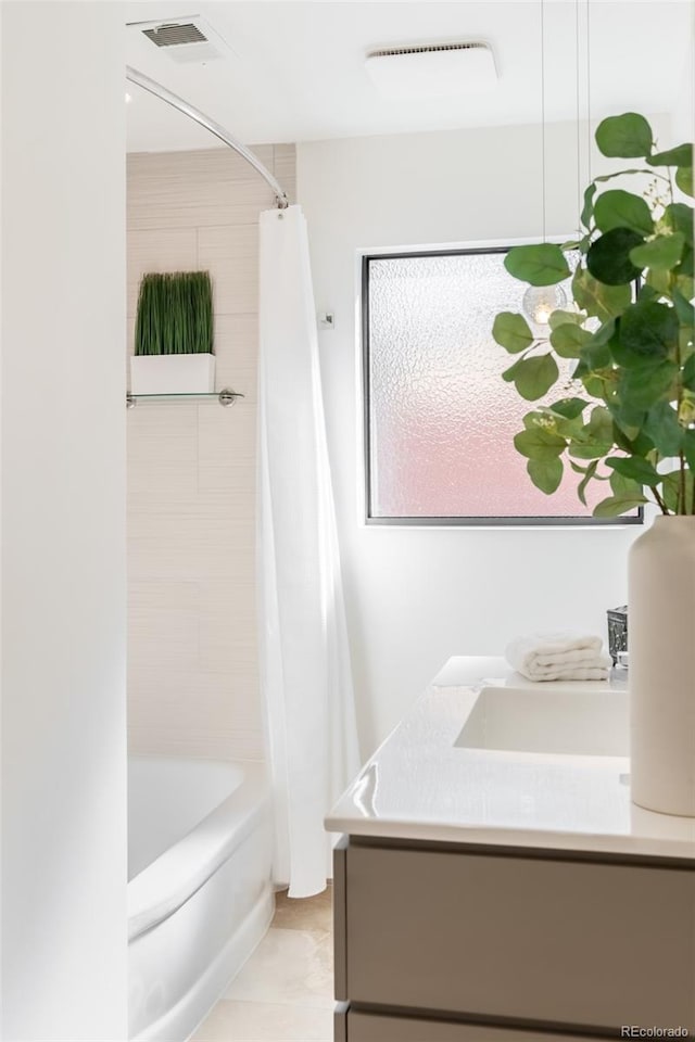 bathroom featuring vanity and shower / tub combo with curtain