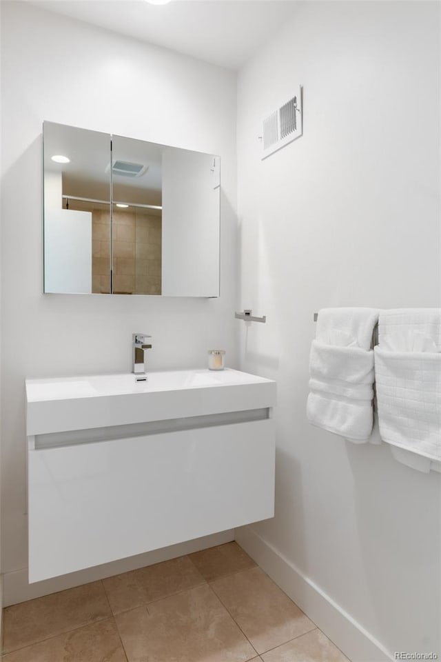 bathroom featuring vanity and tile patterned flooring