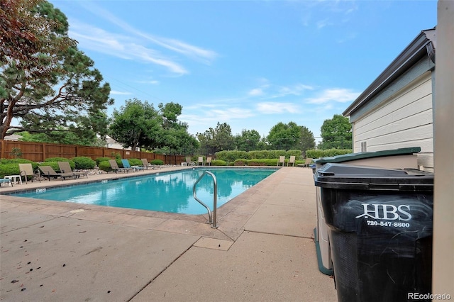 view of swimming pool with a patio