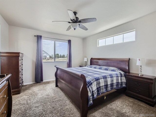 bedroom featuring carpet floors, multiple windows, and ceiling fan