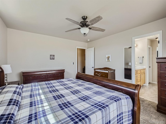 carpeted bedroom featuring ceiling fan and connected bathroom