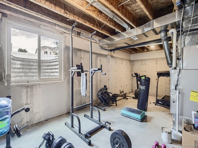 workout area featuring concrete floors