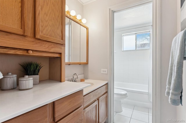 full bathroom with vanity, tiled shower / bath combo, tile patterned floors, and toilet