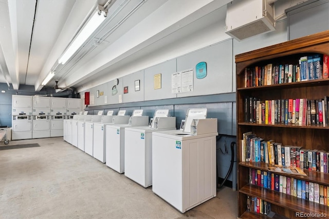 community laundry room with independent washer and dryer