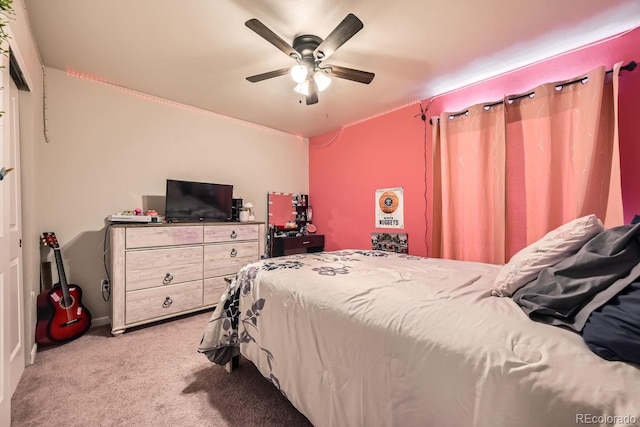 bedroom featuring light colored carpet and ceiling fan