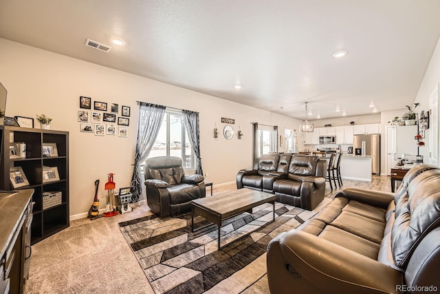 living room featuring light colored carpet