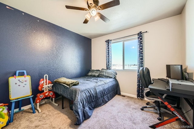 bedroom featuring light colored carpet and ceiling fan