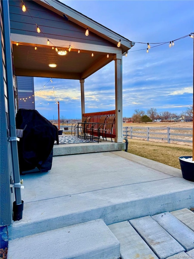 view of patio featuring area for grilling and a rural view