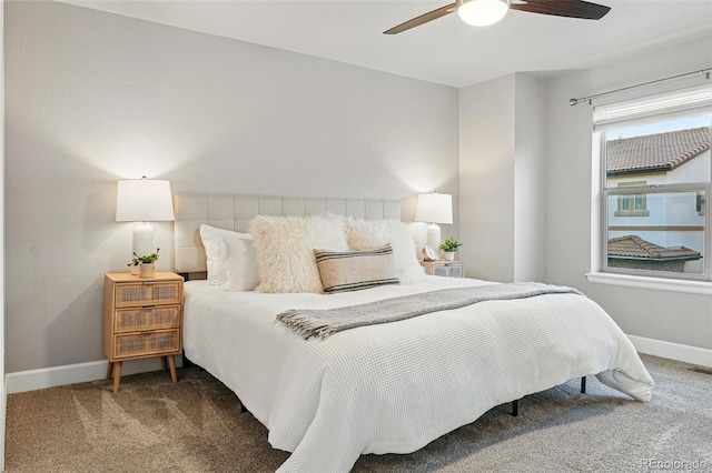 carpeted bedroom with baseboards and ceiling fan