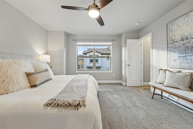 bedroom featuring carpet floors, baseboards, and a ceiling fan