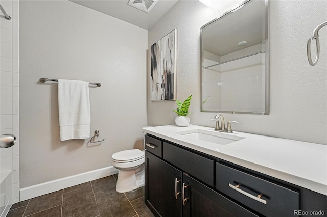 bathroom with toilet, vanity, baseboards, and visible vents