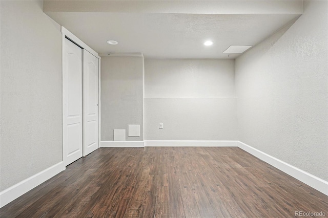 spare room featuring recessed lighting, baseboards, and wood finished floors