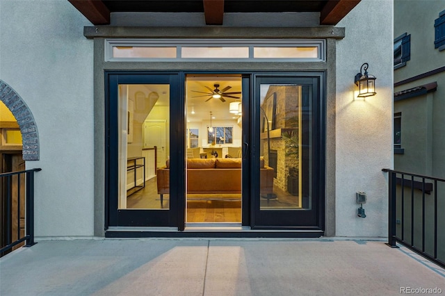 property entrance featuring stucco siding