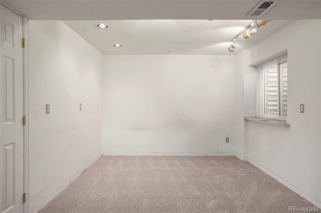 unfurnished room with light colored carpet