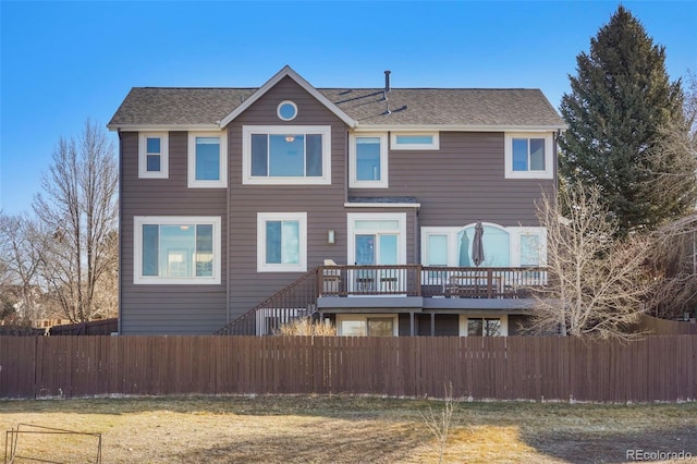 rear view of house with a yard