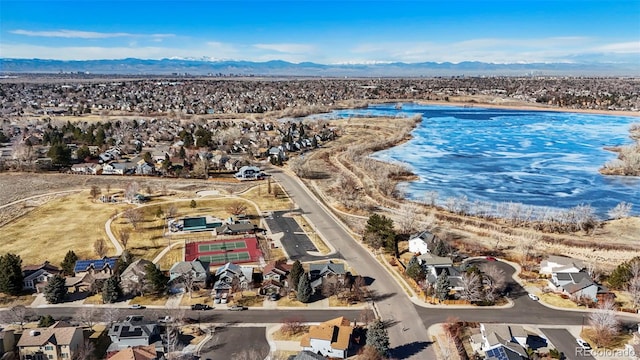 aerial view featuring a water and mountain view