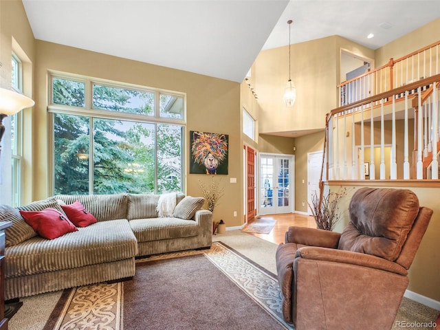 3648 Heatherwood Way, Evergreen, CO 80439 - living room with carpet, a towering ceiling, and healthy amount of natural light