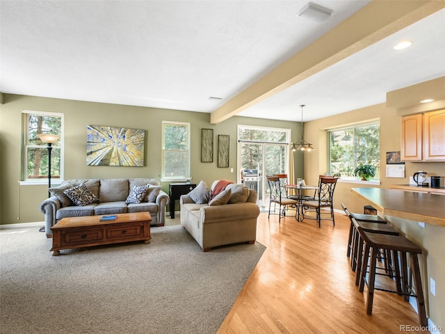 3648 Heatherwood Way, Evergreen, CO 80439 - living area featuring healthy amount of natural light, beam ceiling, light wood-style flooring, a chandelier, and recessed lighting