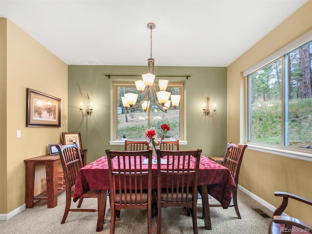 3648 Heatherwood Way, Evergreen, CO 80439 - carpeted dining room with a chandelier and healthy amount of natural light