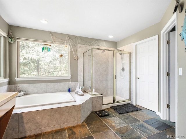 3648 Heatherwood Way, Evergreen, CO 80439 - bathroom featuring a garden tub, a shower stall, and vanity