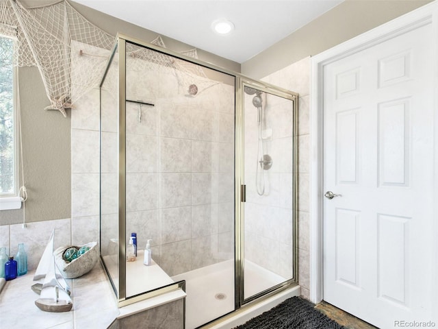 3648 Heatherwood Way, Evergreen, CO 80439 - bathroom featuring a stall shower and tasteful backsplash