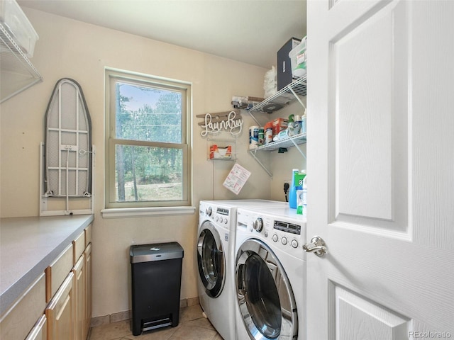 3648 Heatherwood Way, Evergreen, CO 80439 - laundry room featuring independent washer and dryer, cabinet space, and light tile patterned floors