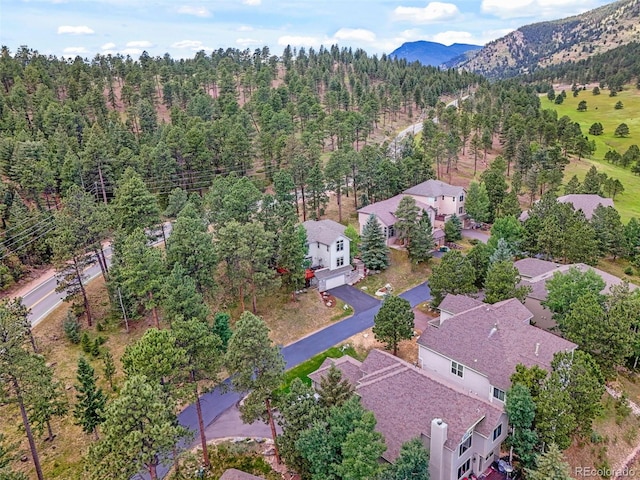 3648 Heatherwood Way, Evergreen, CO 80439 - drone / aerial view of a mountainous background and a forest