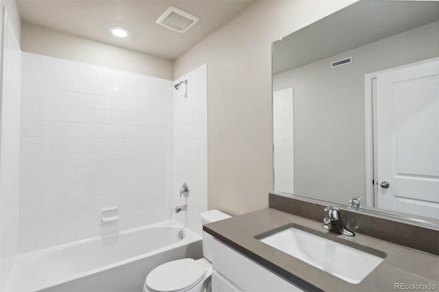 bathroom with vanity, toilet, visible vents, and shower / bath combination